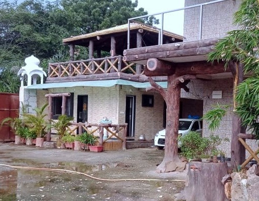 Faux Bois tree trunk sculpture in a landscape