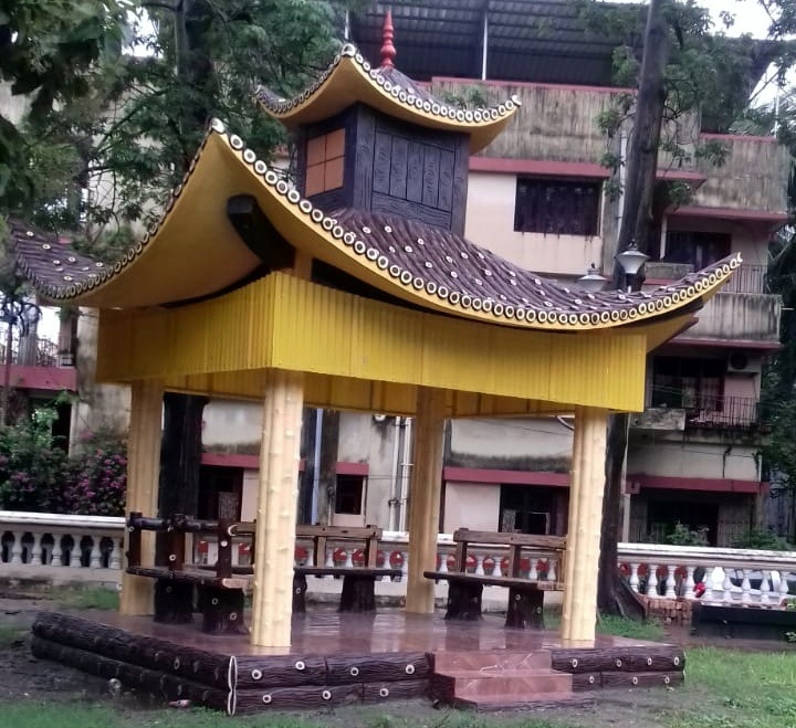 Faux Bois tree trunk sculpture in a landscape