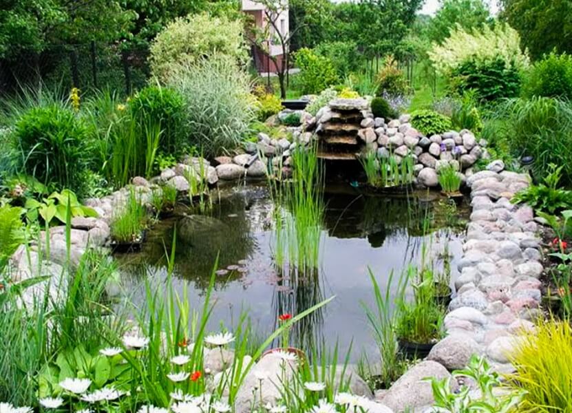 Outdoor seating area with stone pavers and benches