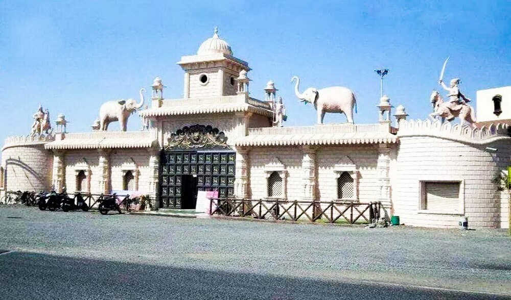 Large stone sculpture in a serene garden setting